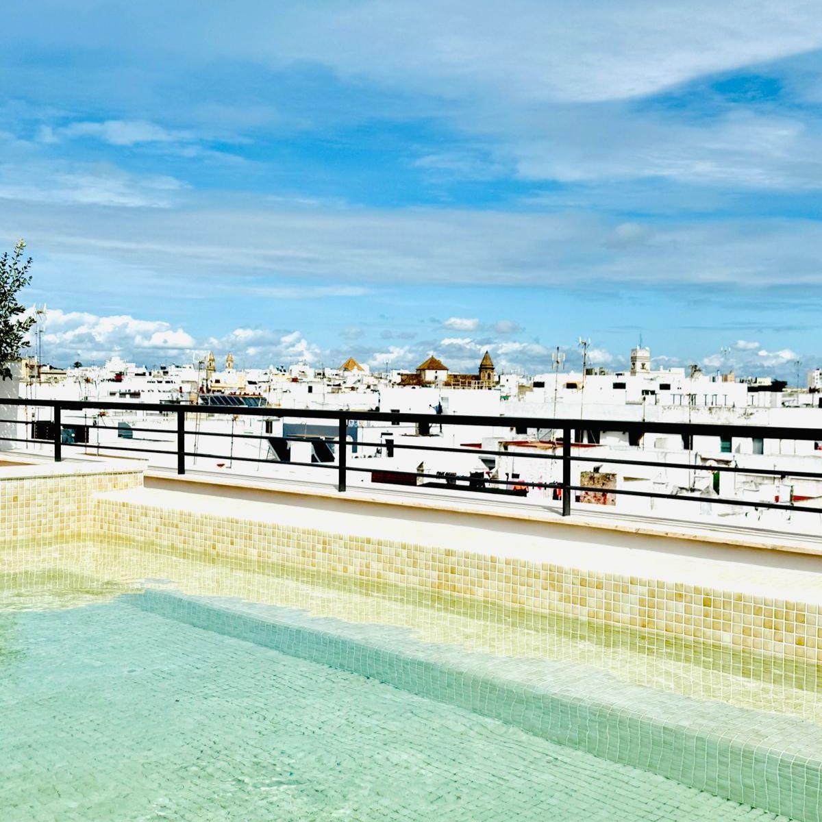 Terrace with pool and panoramic view of the city<br>QE LA CALETA